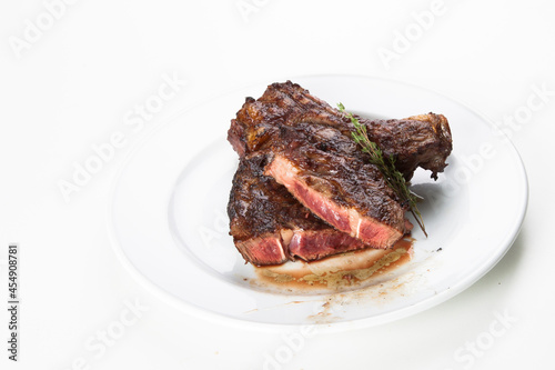 grilled beef fillet steak meat with rosemary isolated on white background