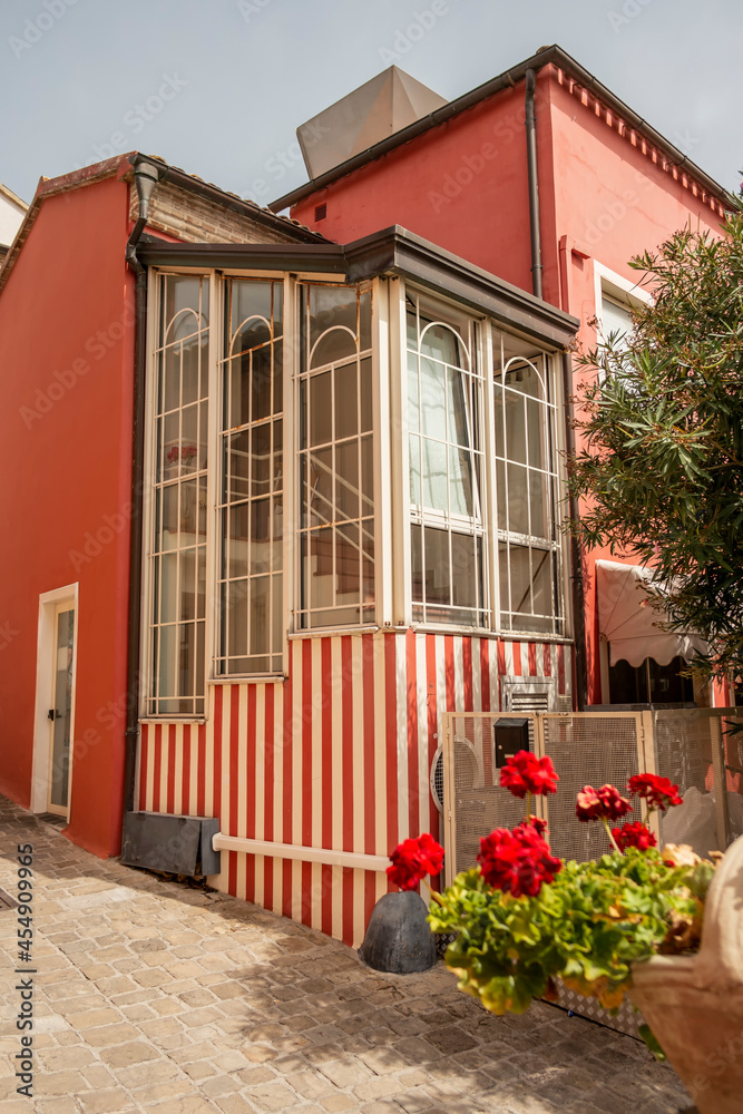 House with red and white stripes located in Numana, Riviera del Conero, Marche - Italy