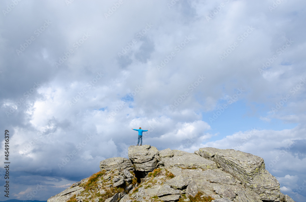 Fototapeta premium person on top of mountain