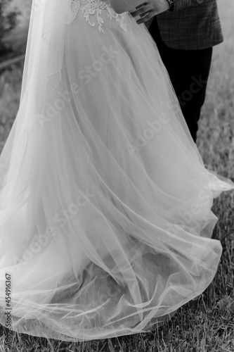 White wedding dress dressed on the bride for the engagement ceremony