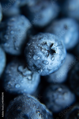 on blue berries blueberries water drops close-up, macro.