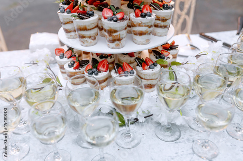 Beautiful dessert for guests at a wedding. Fruit strawberries. Delicious handmade snack for a holiday.