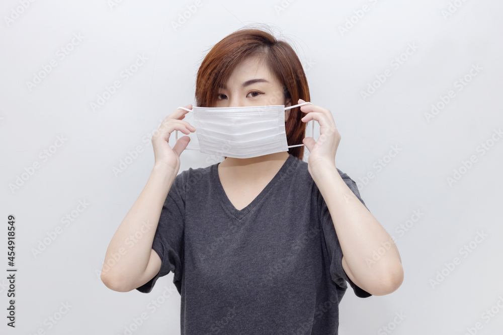 Asian Woman Wearing Virus Protective surgical Mask to Protect Herself From Covid-19 or Pollution Asian Woman Wearing Virus Protective surgical Mask to Protect Herself From Covid-19 or Pollution