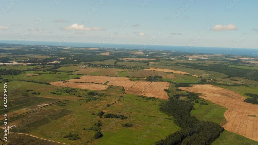 View from the airplane window to forests and fields View from the airplane window to forests and fields