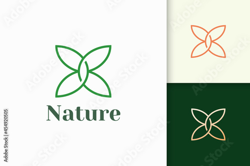Flower logo in feminine and luxury style for health and beauty