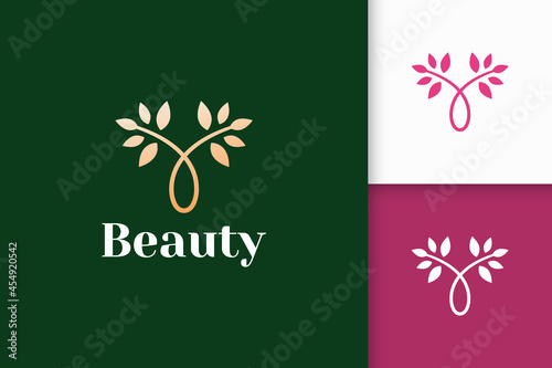 Luxury flower logo from combination of plant and port for beauty care