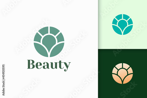 Flower logo in abstract shape for health and beauty
