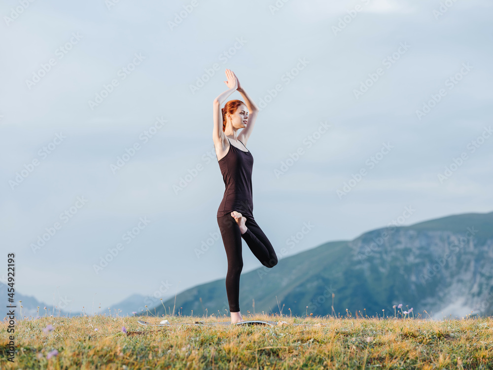 Athletic woman exercise gymnastics nature mountains Athletic woman exercise gymnastics nature mountains