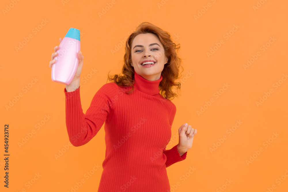 hair conditioner advertisement. beauty product. daily habits and personal care. redhead lady hair conditioner advertisement. beauty product. daily habits and personal care. redhead lady