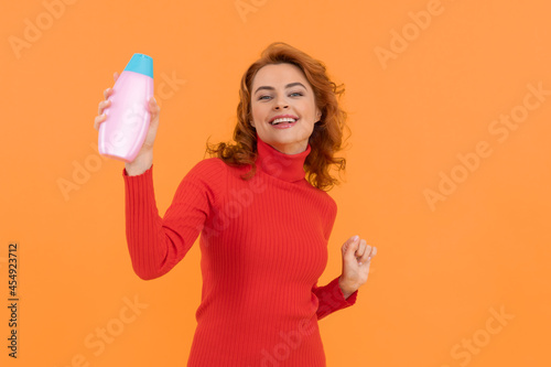 hair conditioner advertisement. beauty product. daily habits and personal care. redhead lady