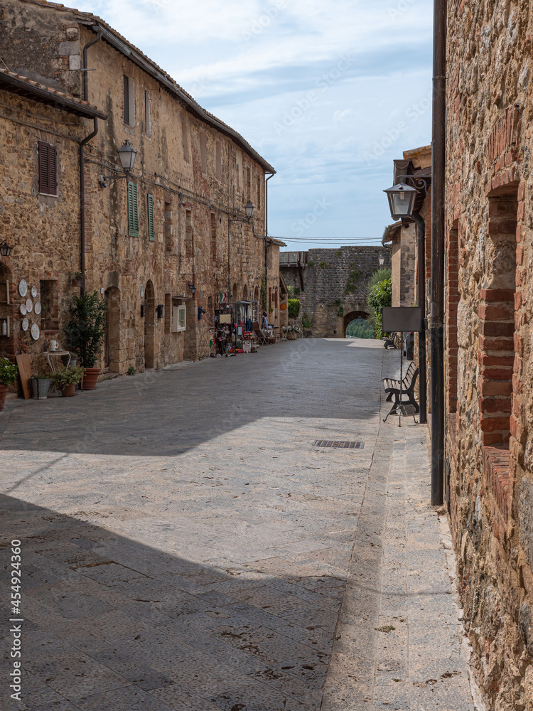 Main Street with Typical Buildings in the Medieval Village of  Monteriggioni, Siena - Italy