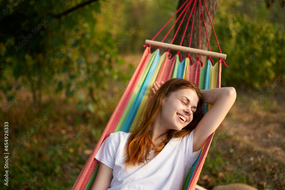 cheerful woman lies in a hammock in nature sun rest cheerful woman lies in a hammock in nature sun rest