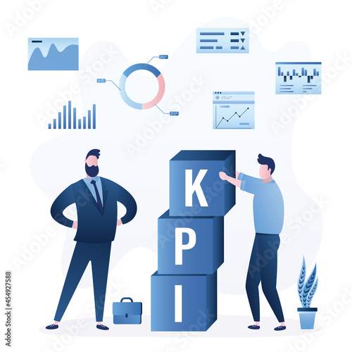 KPI, Key Performance Indicator. Businessman holds big cubes with word KPI. Measure business success, marketing campaign goal and target achievement.