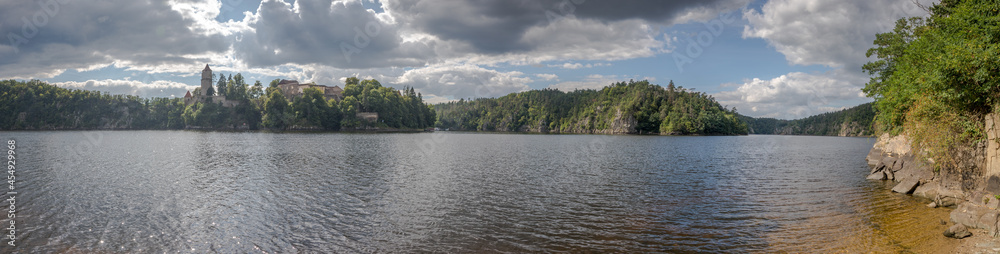 panoramic view of the castle ruins on the rock above the dam