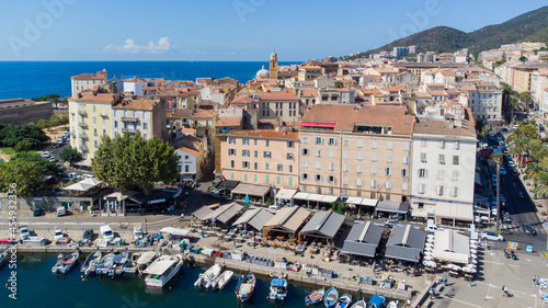 Fototapeta Naklejka Na Ścianę i Meble -  Aerial view of the old city center of Ajaccio in Corsica - Waterfront promenade lined with restaurants near the birth house of Napoleon Bonaparte in France