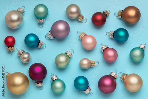 Christmas or New Year Festive pastel Christmas balls over blue background
