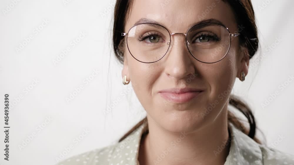 Smiling woman with glasses on white background. Portrait of friendly smiling caucasian woman wearing eyeglasses on white background. Close-up Smiling woman with glasses on white background. Portrait of friendly smiling caucasian woman wearing eyeglasses on white background. Close-up
