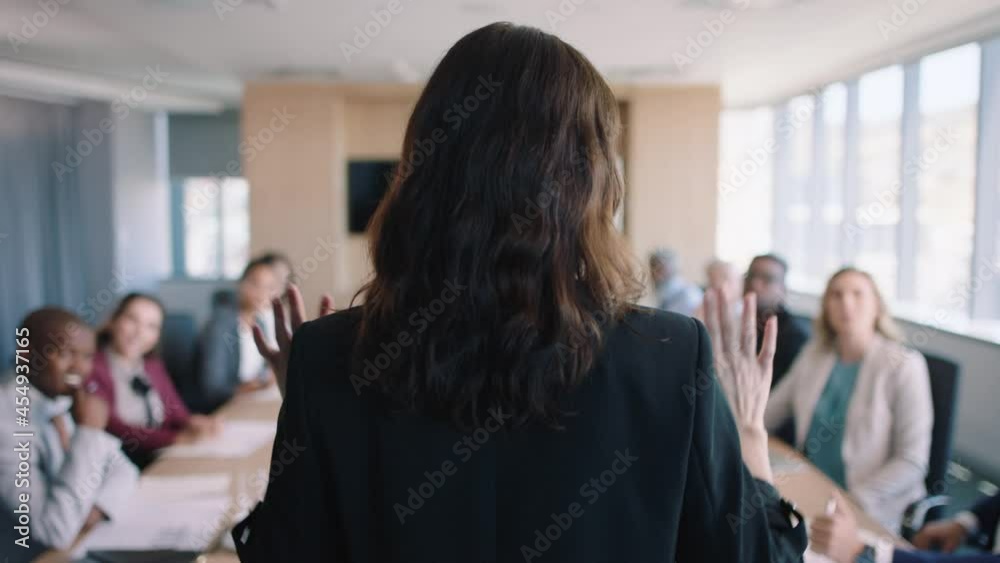 rear view business woman team leader discussing project with colleagues sharing creative ideas in office meeting planning strategy 4k