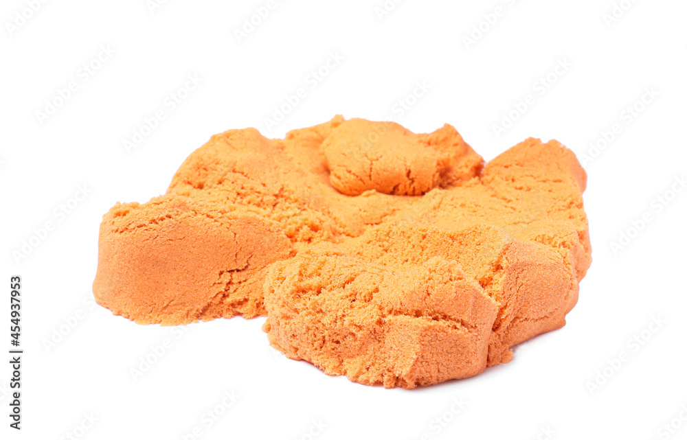 Pile of orange kinetic sand on white background