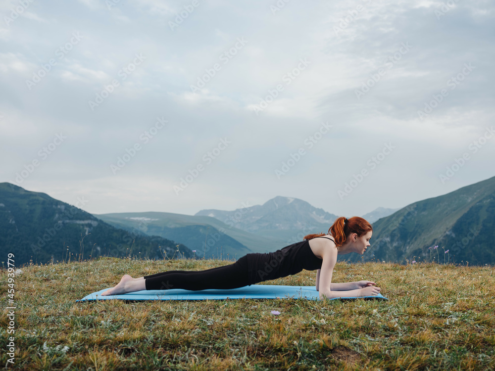 woman doing gymnastics exercise mountains nature yoga