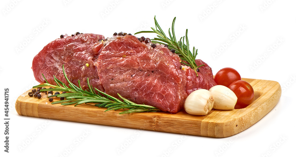 Fresh beef meat with spices, isolated on white background.