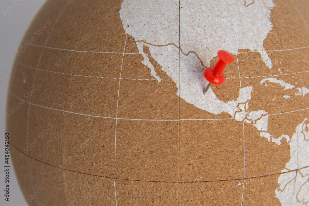World cork ball showing Mexico with 1 red thumbtack marking Mexico City