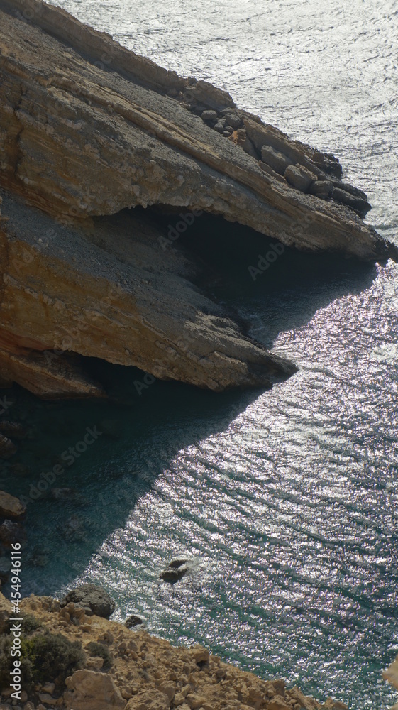 Obraz premium rocks in the sea rocks in the sea in the Greek island of koufonisi August 2021