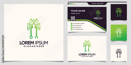 Creative wrench and tree logo with unique linear style and business card design Premium Vector