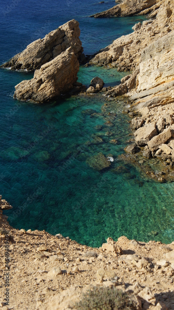 coast of island t and rocks in kato koufonisi island Cyclades Greece coast of island t and rocks in kato koufonisi island Cyclades Greece