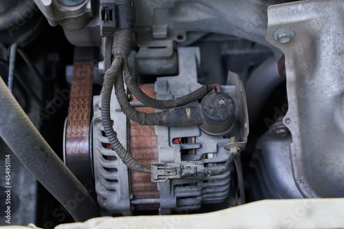 car generator or alternator in the engine room of a modern car. close up generator or alternator background. dynamo, dinamo 