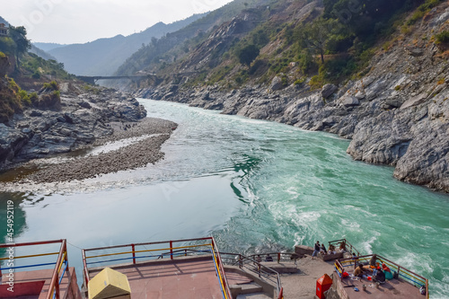 Devprayag, Uttarakhand, India-November 2015: Confluence of Bhagirathi and Alakananda river after which both rivers merges and flows as Ganges river or Ganga. photo