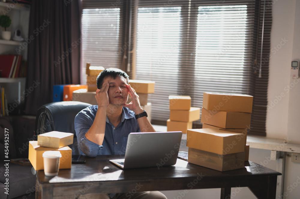 Tired young man from computer work,stressed man suffer from headache ...