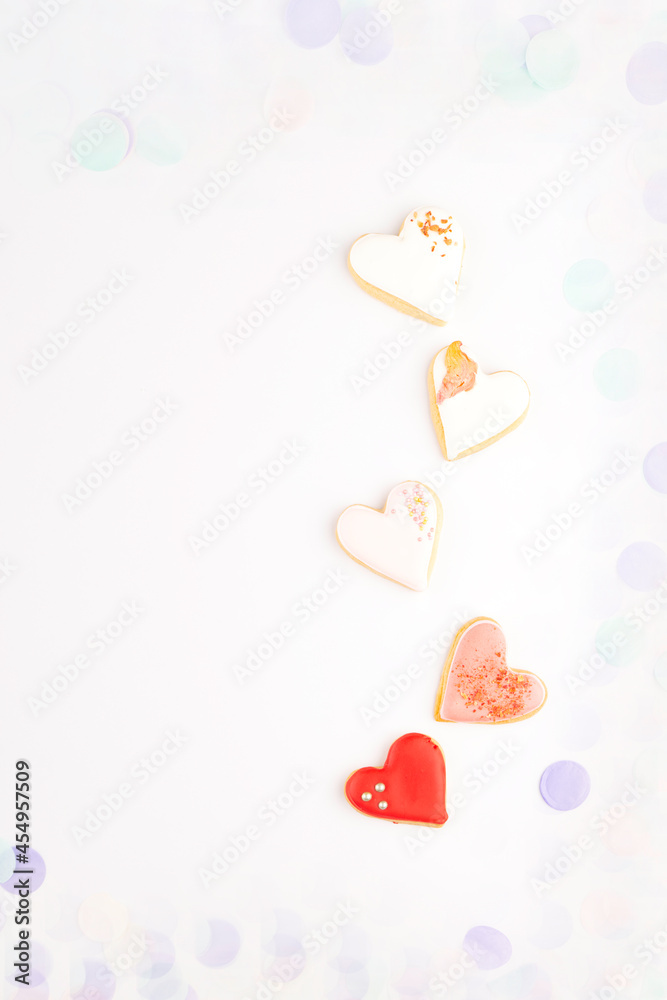 Heart shaped cookies with colorful festive confetti