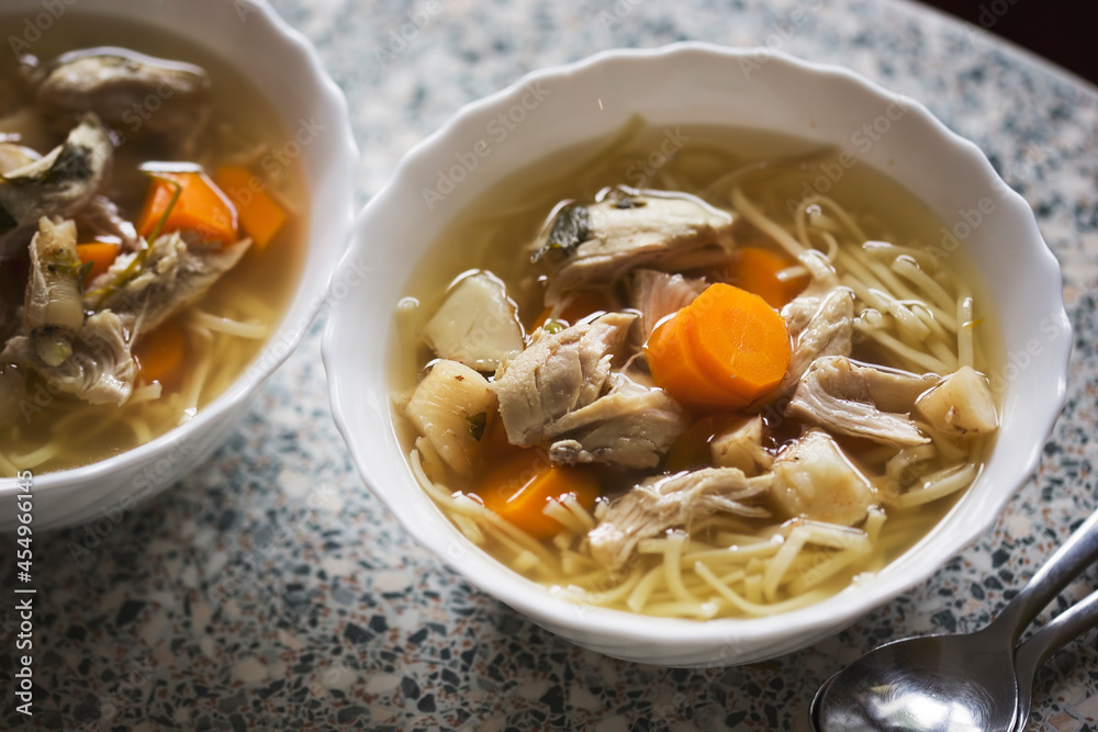 Chicken soup with carrot, vegetables and pasta Chicken soup with carrot, vegetables and pasta
