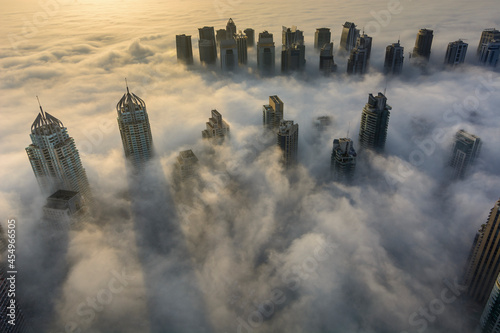 Beautiful aerial view of Dubai Marina in fog  United Arab Emirates.