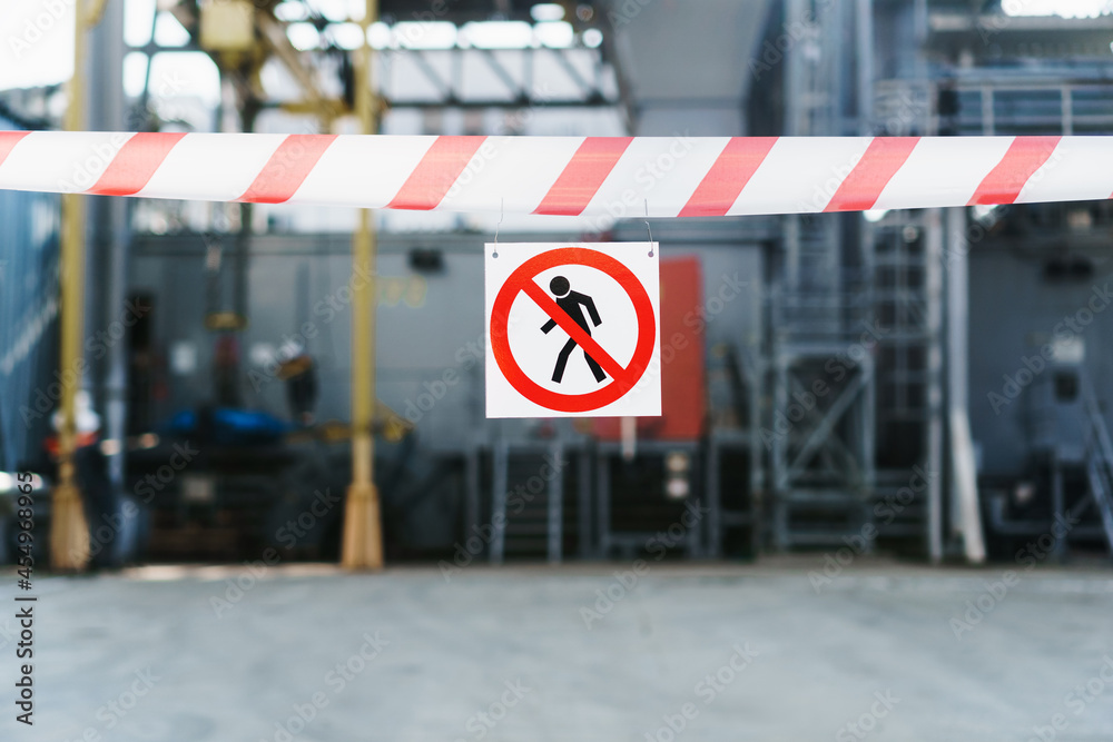 custom made wallpaper toronto digitalThe poster No trespassing is allowed on a red and white ribbon fencing the passage against the background of the pipes of the power plant.