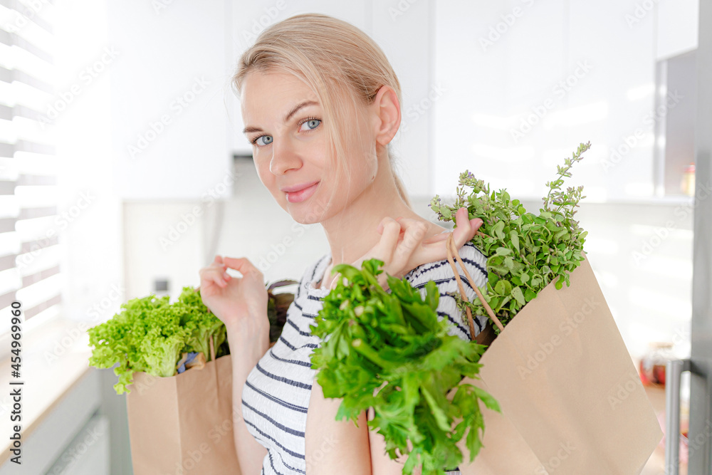 pregnant woman with packages of fresh herbs, green smoothies. the concept of wholesome and healthy food for pregnant women pregnant woman with packages of fresh herbs, green smoothies. the concept of wholesome and healthy food for pregnant women