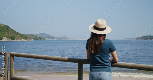 Woman look at the sea view © leungchopan