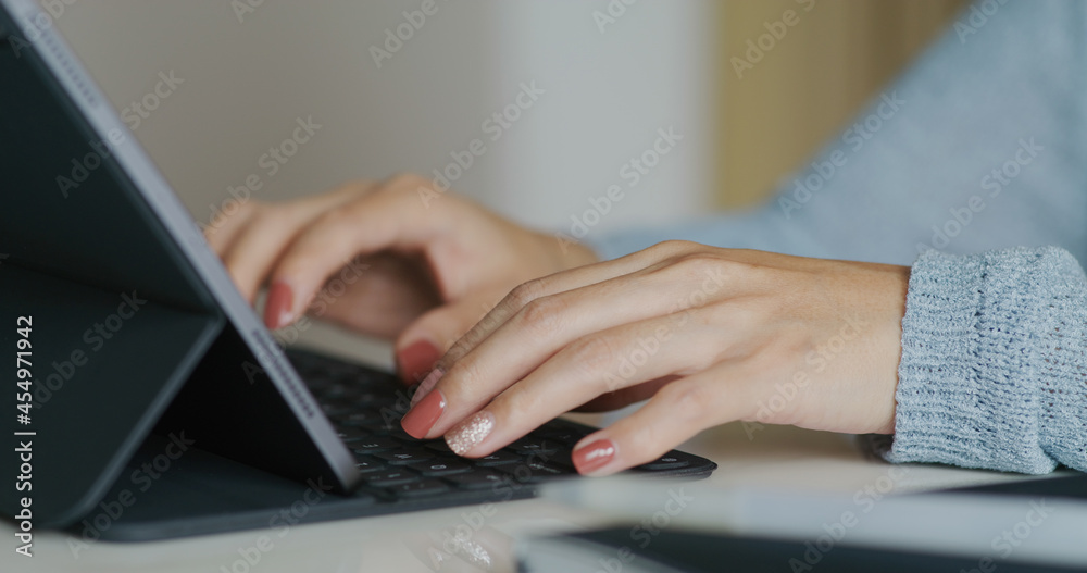 Woman work on tablet computer at home Woman work on tablet computer at home
