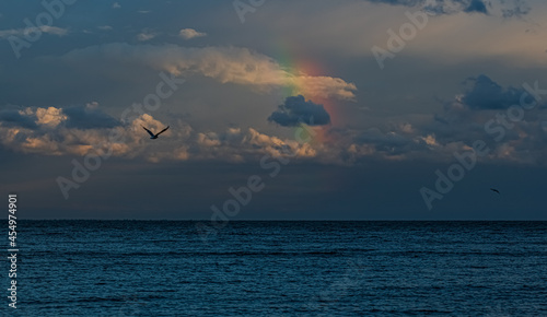 Rainbow over the evening sea