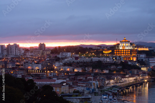 Panoramic view on Douro river and old part of Porto city in Portugal at cloudy sunset
