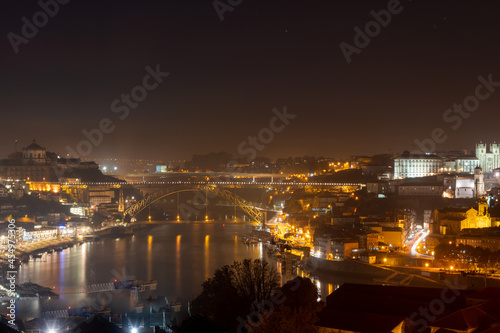 Panoramic view on old part of Porto city in Portugal at night © barmalini