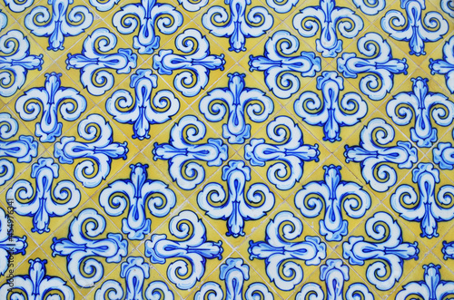 hand painted yellow ceramic tiles with blue and white decorative pattern