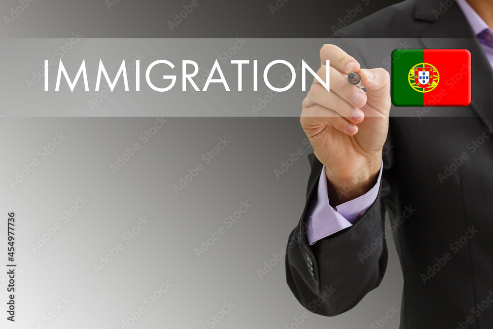 Man hand pressing the word immigration on a virtual search display screen. Online application for immigration. Man hand pressing the word immigration on a virtual search display screen. Online application for immigration.