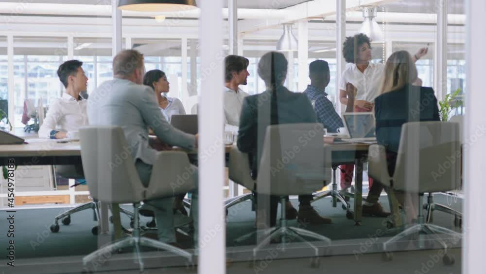 group of business people meeting in boardroom team leader woman presenting ideas on whiteboard discussing strategy with colleagues in office training presentation 4k