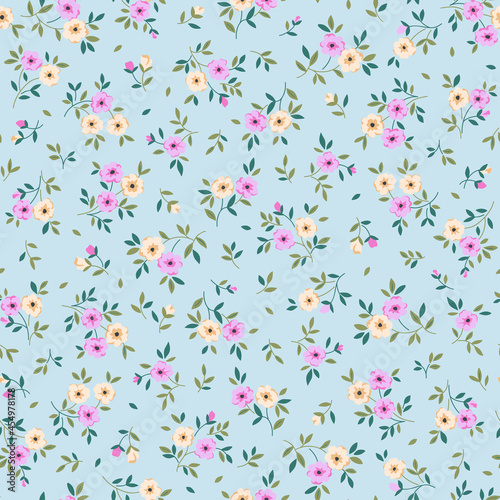 Spring flowers print. Vector seamless floral pattern. Plant design for fashion prints. Endless print made of small pastel color flowers. Elegant template. Pale blue background. Stock vector.