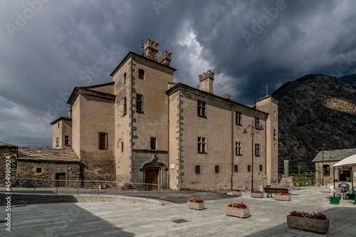 The ancient castle of Issogne, Aosta Valley, Italy, under a dramatic sky photo