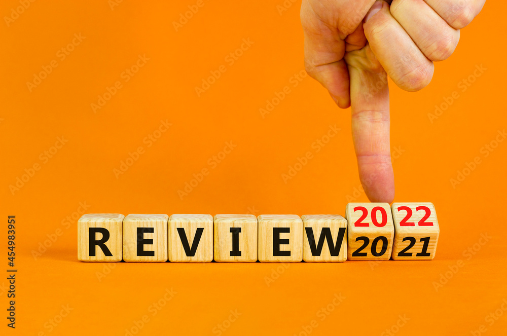 2022 review new year symbol. Businessman turns wooden cubes and changes ...