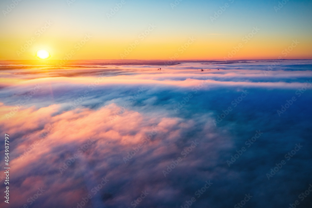 Fantastic misty view of the splendid countryside with the rays of morning light.