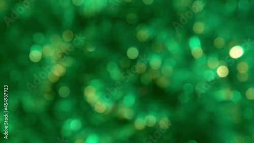 green abstract background of blurred lights with bokeh effect